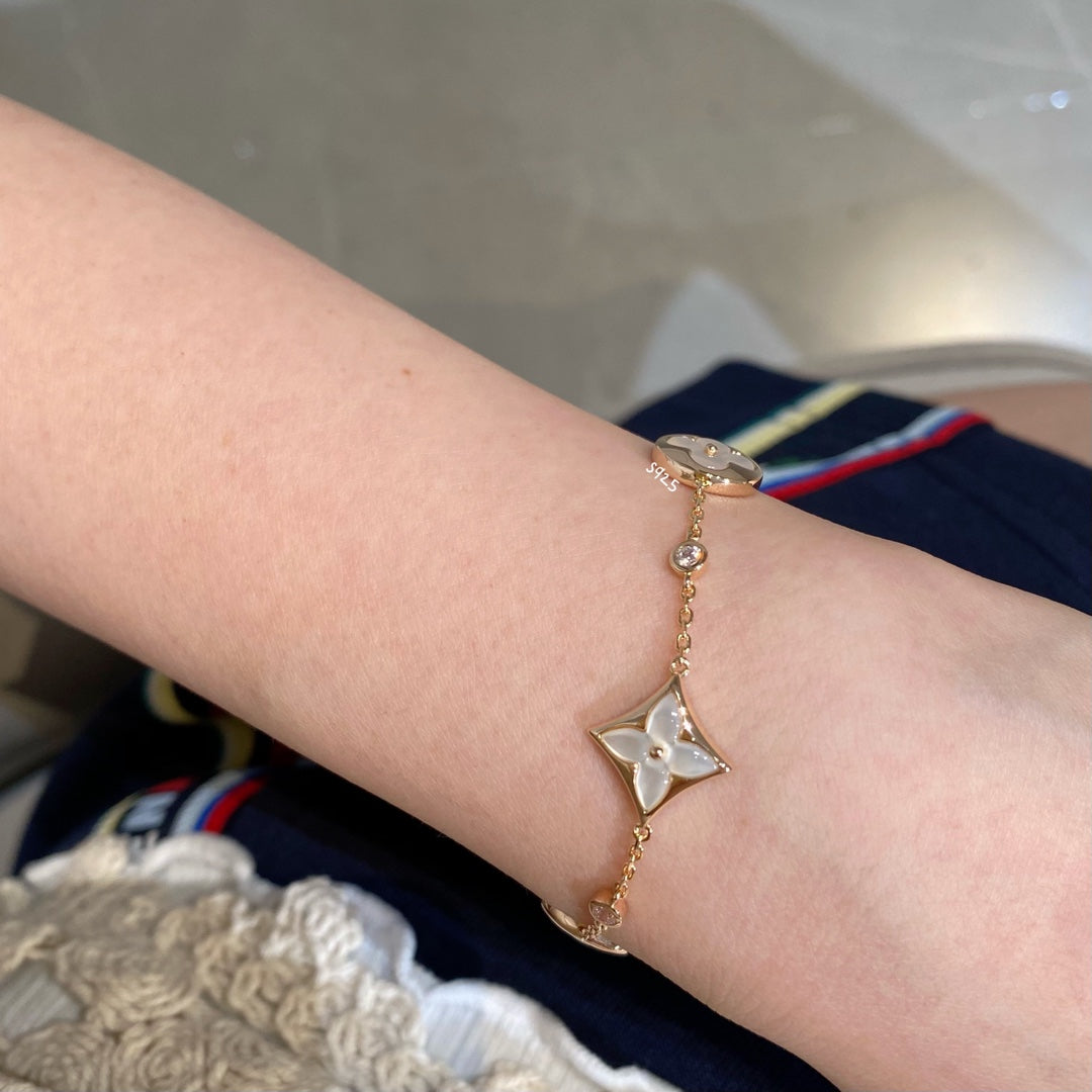 [Love's Uplift]STAR AND SUN 4 MOTIF WHITE MOP PINK GOLD BRACELET